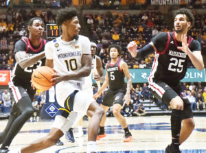 West Virginia uses gritty defense to slide past UMass